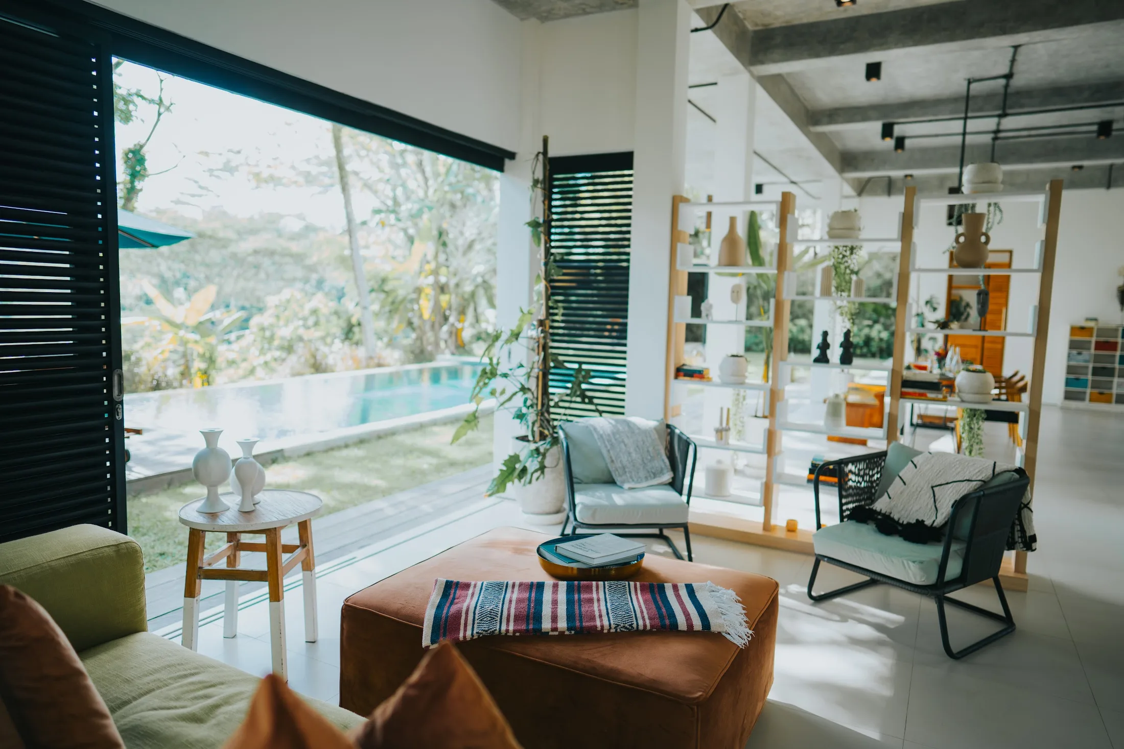 Open living room overlooking tropical greenery